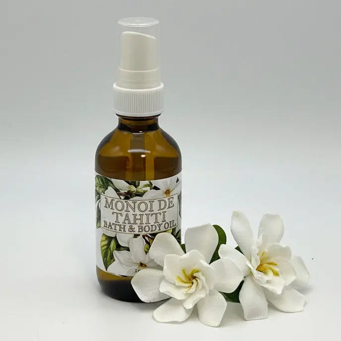 Bottle of Monoi de Tahiti bath and body oil on a white background