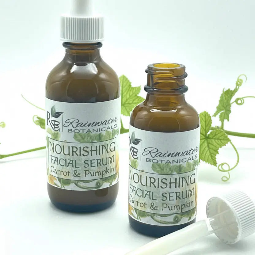 Two bottles of Rainwater Botanicals Nourishing Facial Serum with a dropper on a white background