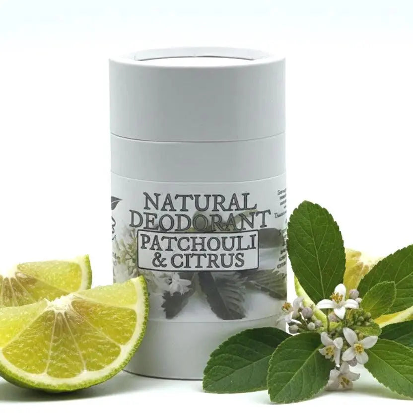 white cardboard container of natural deodorant with patchouli and citrus scent on a white background