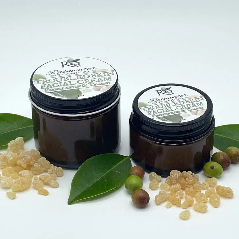 Two jars of Rainwater Botanicals Troubled Skin Facial Cream on a white background