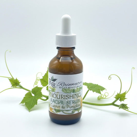 Bottle of Rainwater Botanicals Nourishing Facial Serum with a dropper on a white background