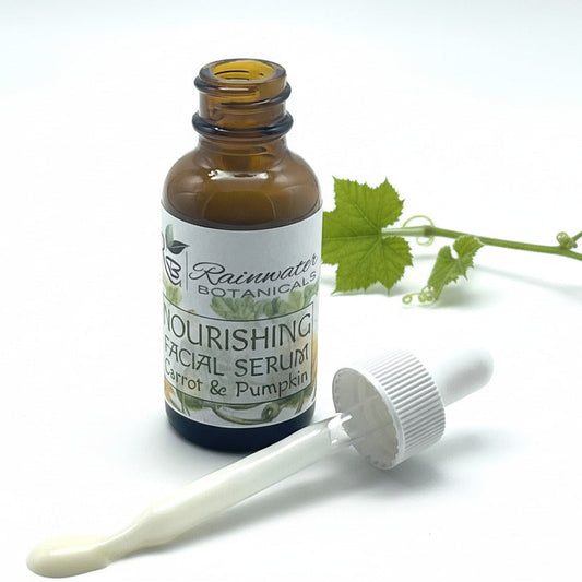 Facial serum bottle with dropper labeled 'Rainwater Botanicals' on a white background