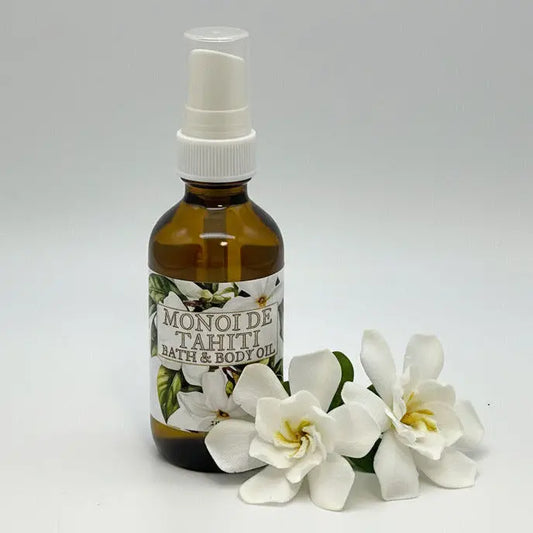 Bottle of Monoi de Tahiti bath and body oil on a white background