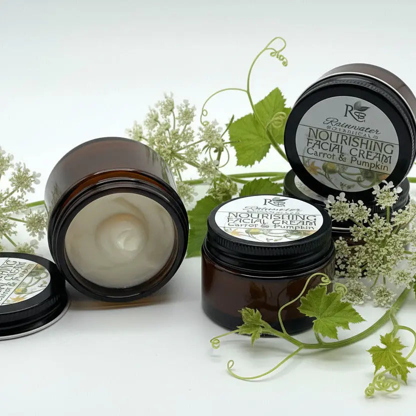 Two brown jars of nourishing facial cream with black lids on a white background